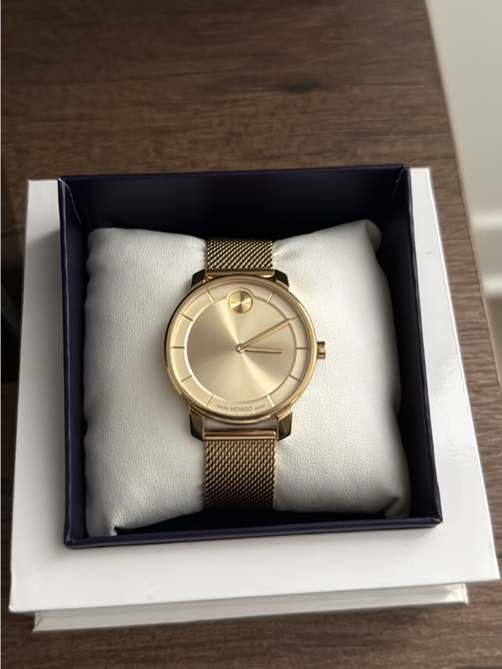 Movado Face Gold Watch.